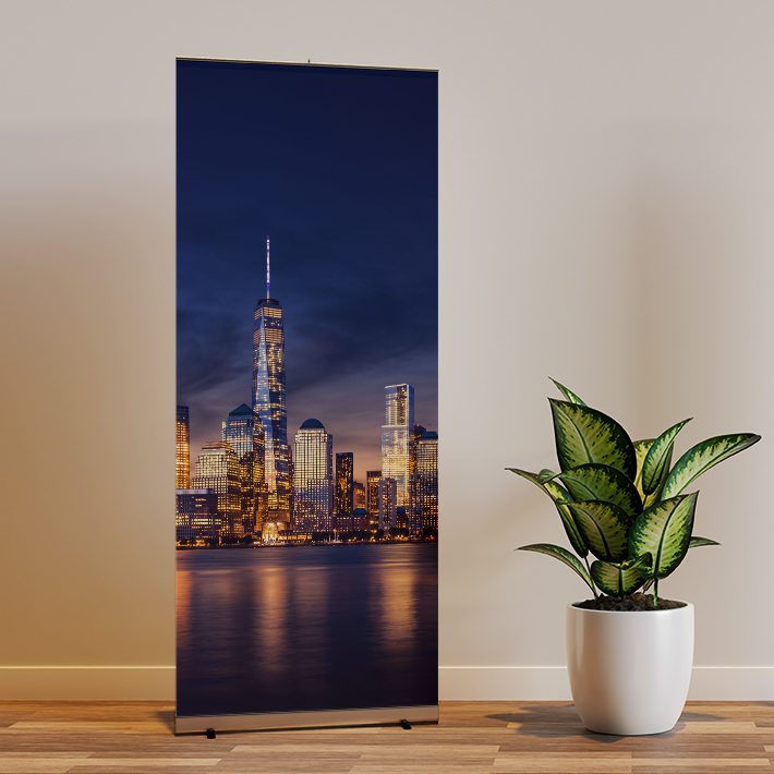 Two roll up banner mockup in interior scene with a plant in the